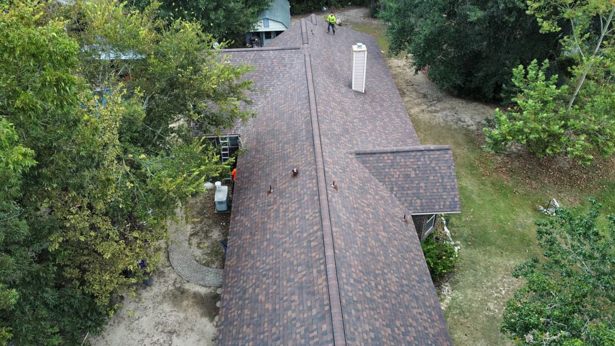 Rayburn's Roofing crew inspecting a residential roof